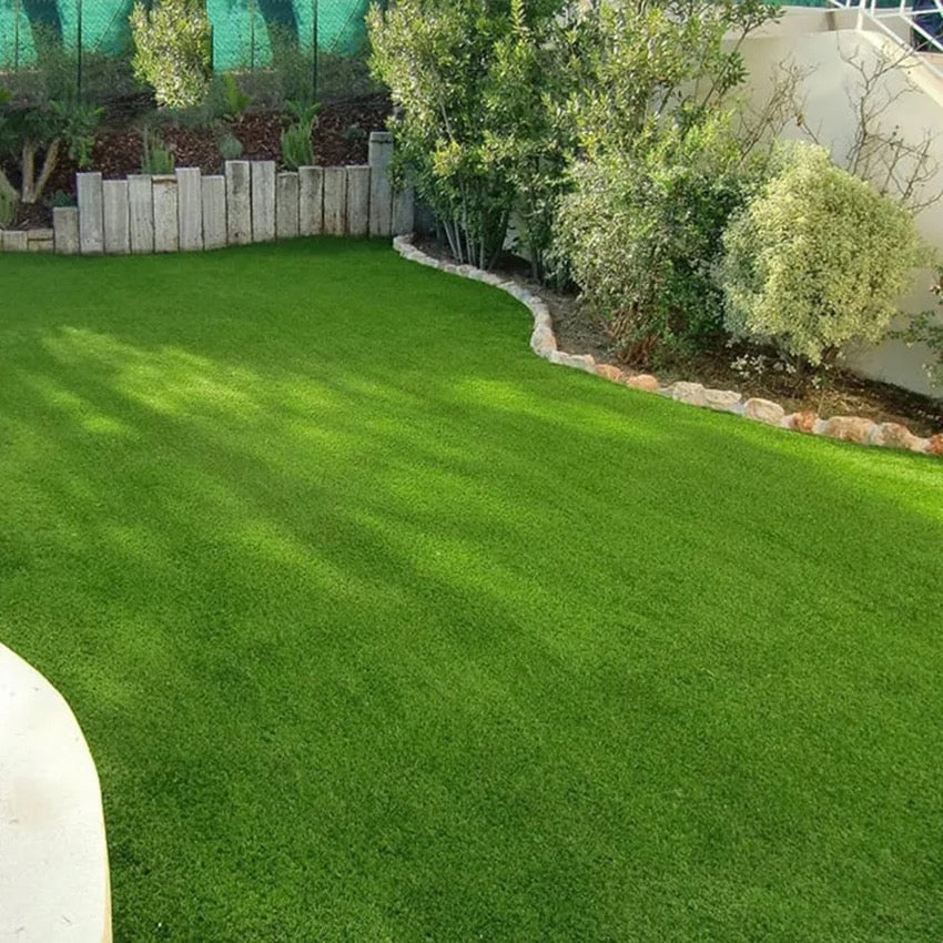 A garden of a house with Artificial Grass Carpet laid on the floor