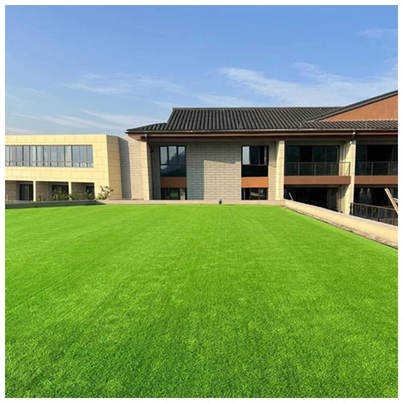 An outdoor of a house with Artificial Grass Carpet laid completely   
