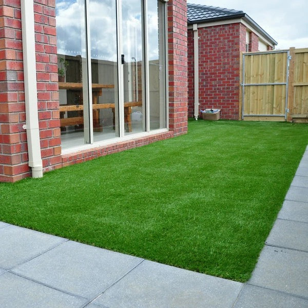 Artificial Grass Carpet laid in a backyard of a house