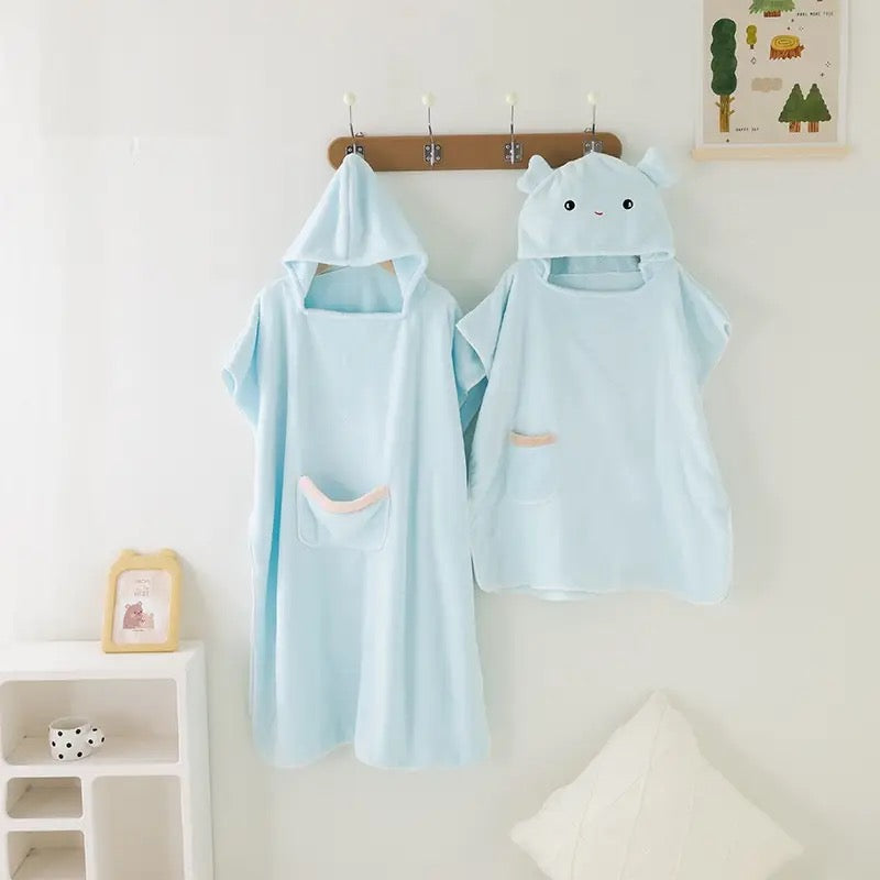 Adult and Children Quick-Drying Hooded Bathrobe hung on wall hook