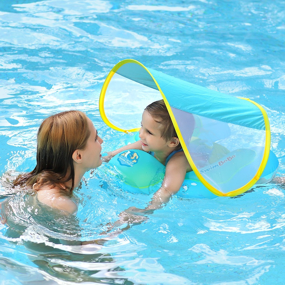 a baby swimming with help of Inflatable Baby Swimming Float