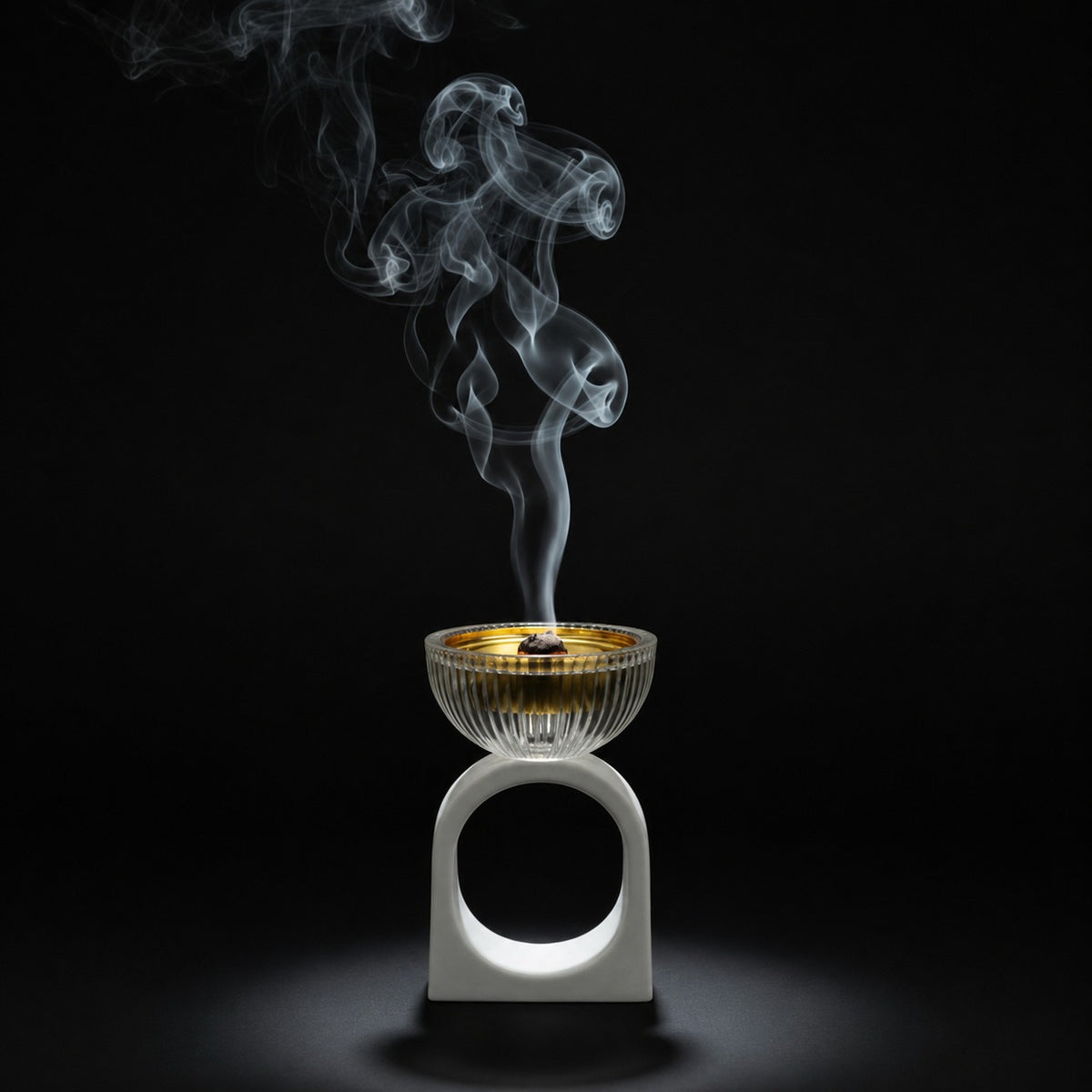Incense burner with smoke on a black background