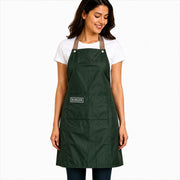 Woman wearing a green apron with 'Burger' logo on a white background