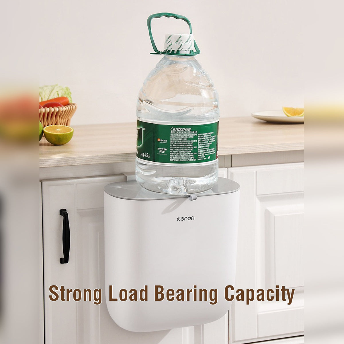 A Full Load Water Can is Placed on Kitchen Garbage Bin.