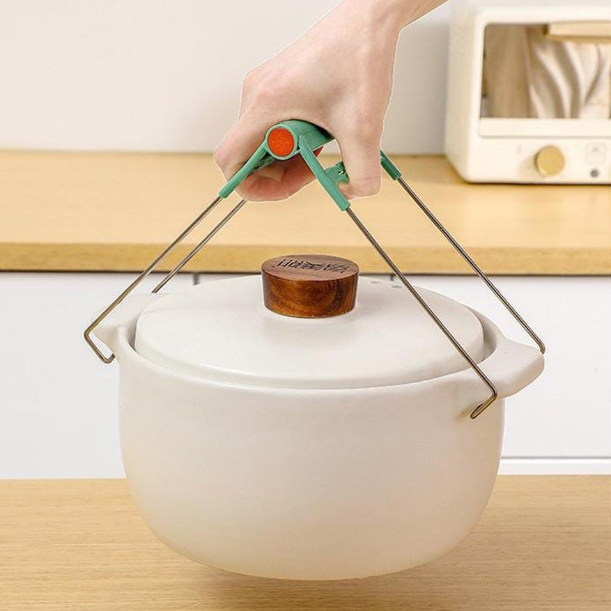 A Person is Holding Kitchen Pot With Bowl Gripper.