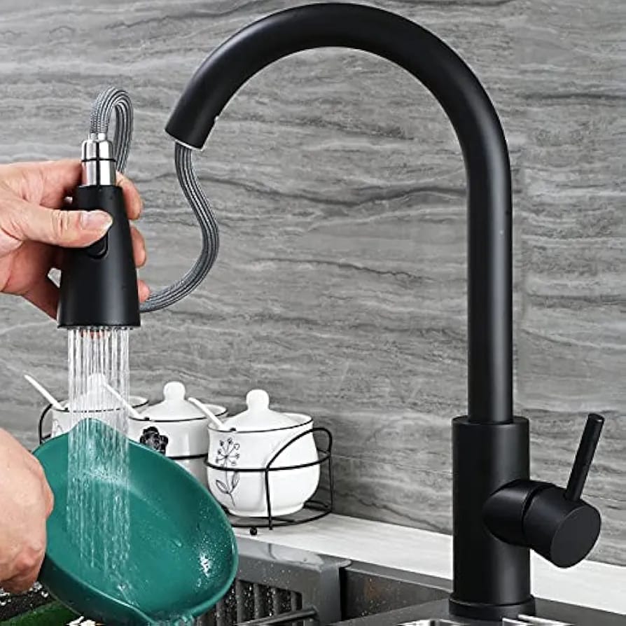 A Person is Cleaning Utensils Using Kitchen Pull Out Tap.