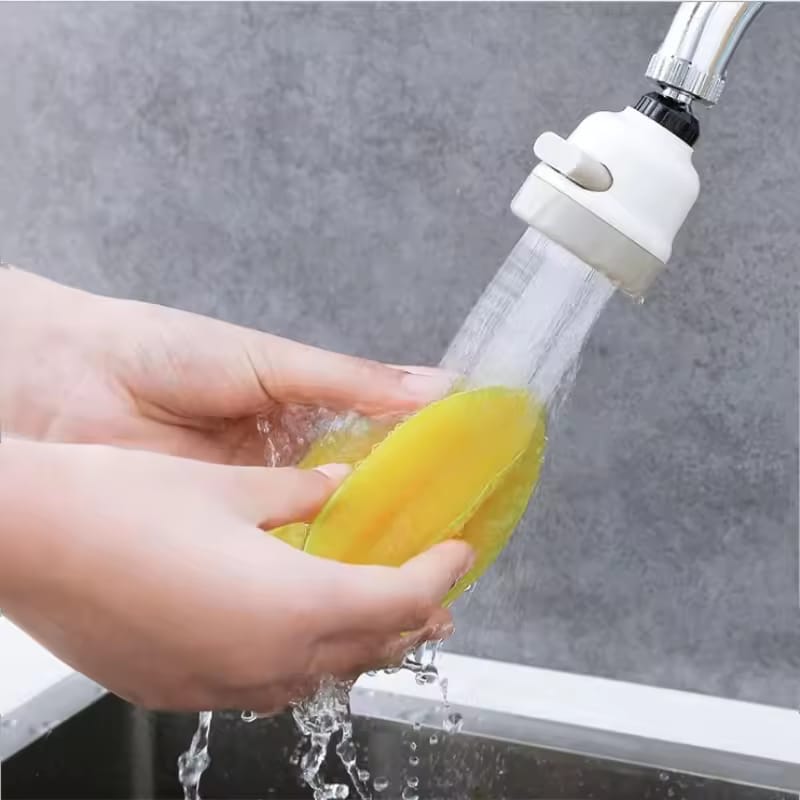 A Person is Washing Fruits From Tap Which is Connected With Kitchen Shower Faucet Tap Head.