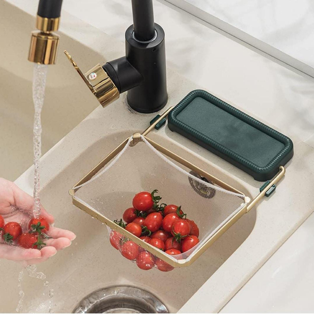 A Person is Draining Tomato Using Kitchen Sink Corner Filter Drainer Strainer Rack Attached On the Snk.