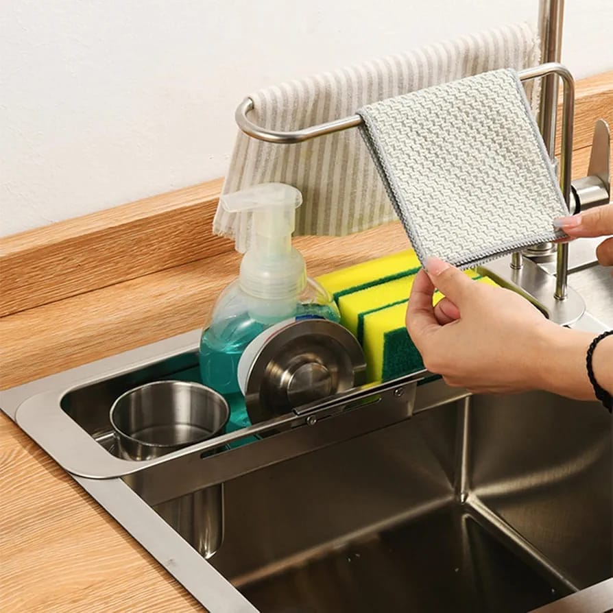 A Person is Organizing Kitchen Sink Organizer Storage Drain Rack.