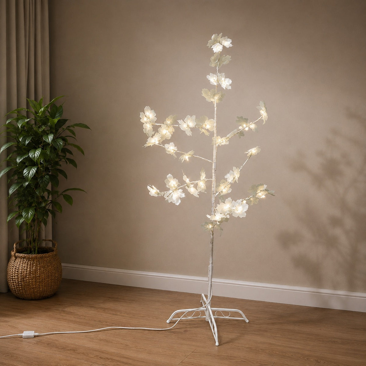 LED Blossom Tree Light Decoration with white flowers on a stand in a room setting.