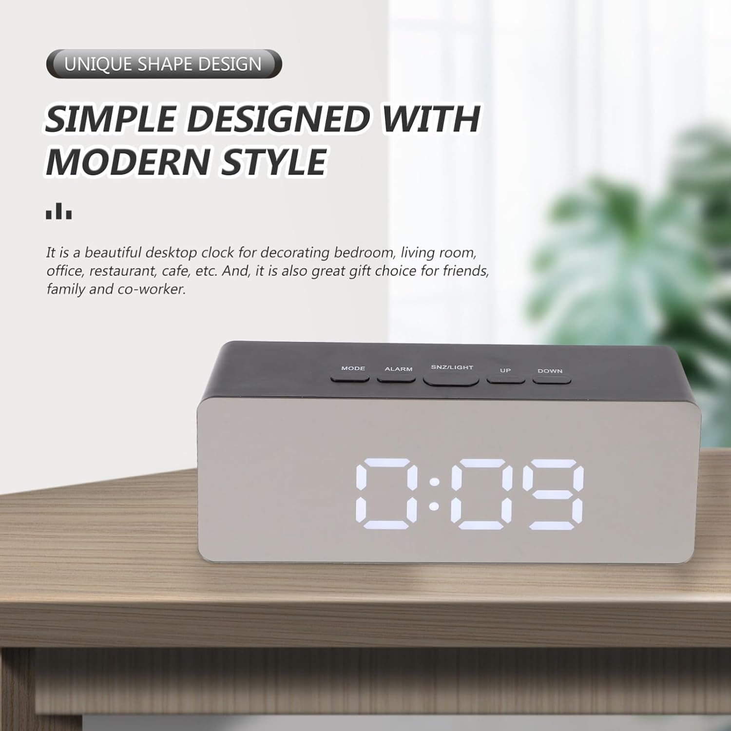A LED Digital Alarm Clock with Mirror Display is Placed on a Table.