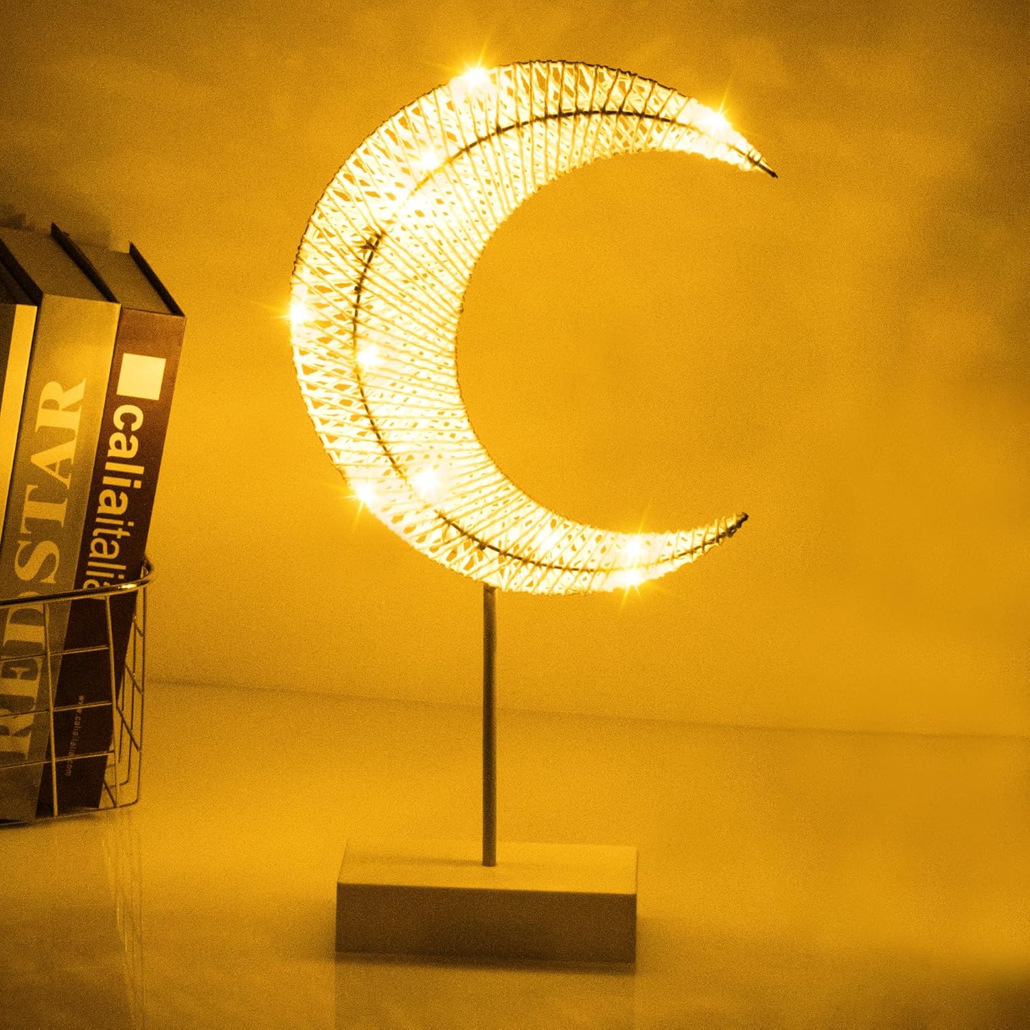 A LED Moon Table Lamp Decorative Night Light is Placed on a Table.