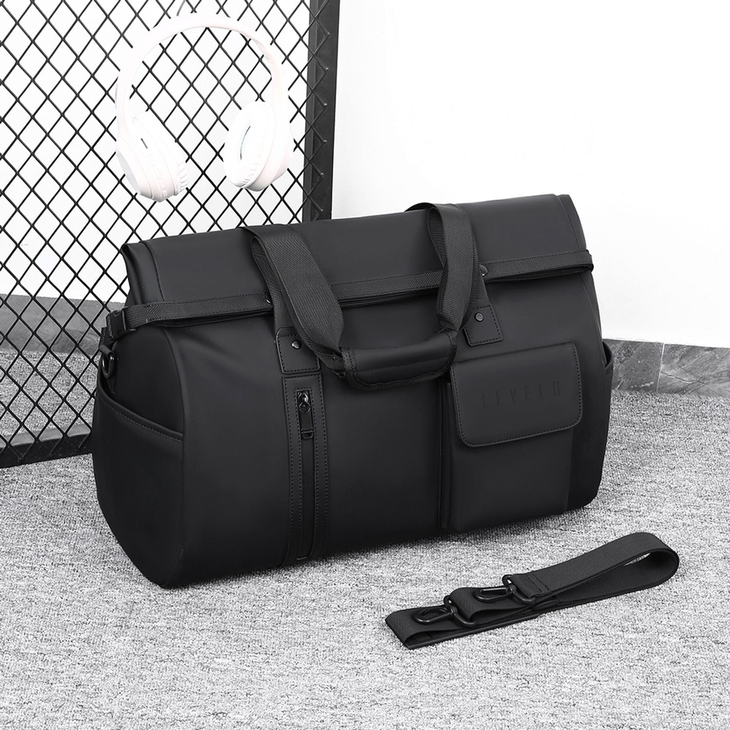 Black bag with a strap on a black background