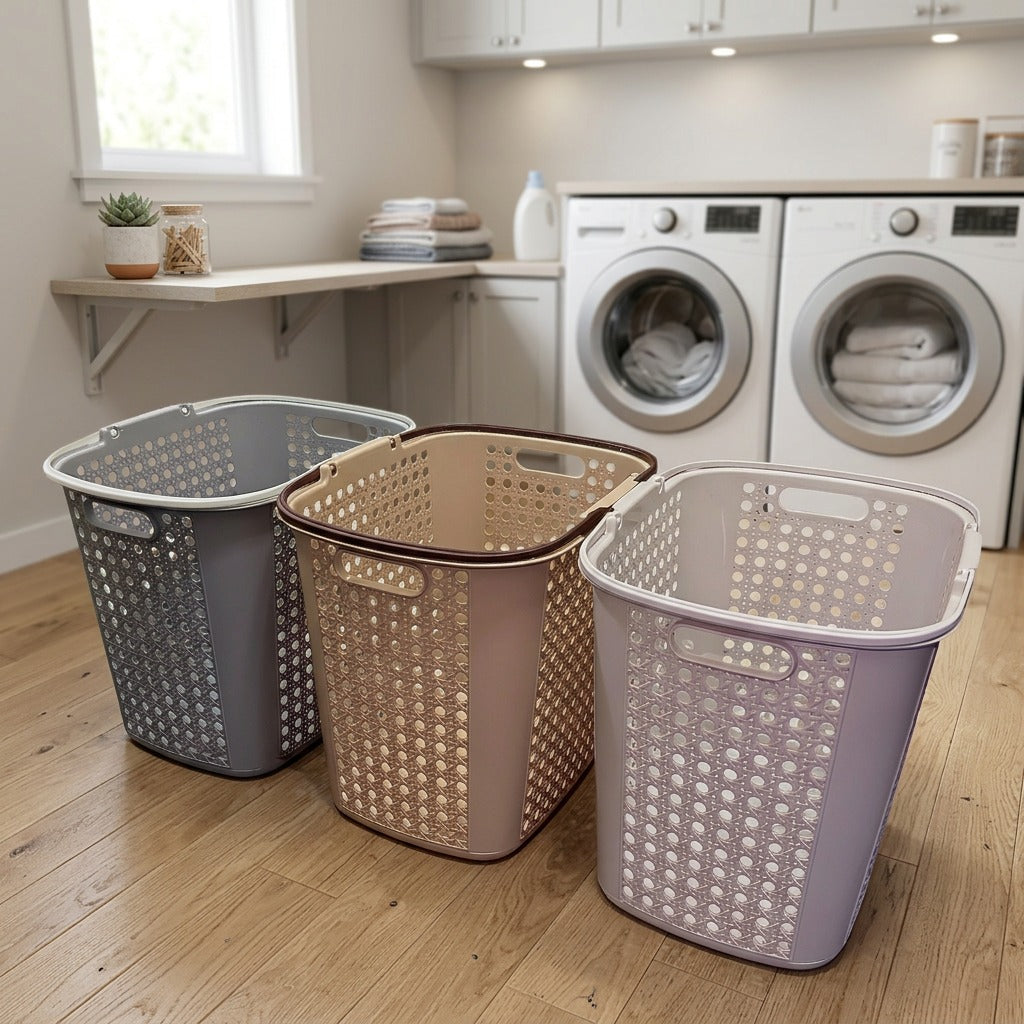 Three laundry baskets in front of a washing machine and dryer in a laundry room.