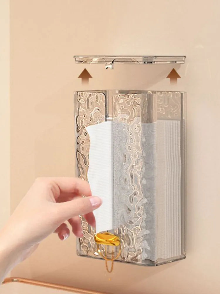A hand taking a Tissue From Tissue Organizer Box mounted in wall