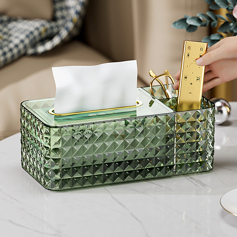 A Person is keeping the remote control on the Compartment Of luxury tissue box holder.