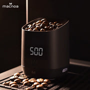 Macnoa MacScale Cup Digital Coffee Dosing Cup with digital display and coffee beans, featuring the brand 'macnoa'.