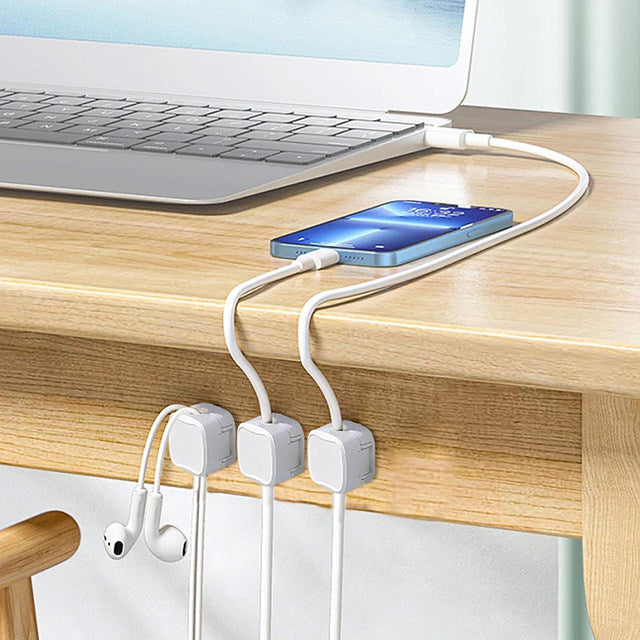 Magnetic Cable clips securely hold charging cables on desk edges.