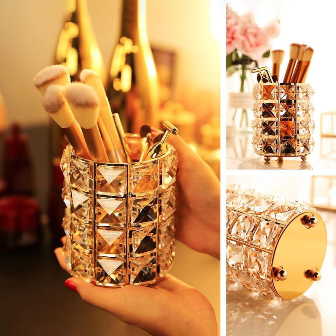 A Person is Holding Makeup Brush Holder Organizer With Makeup Brushes.