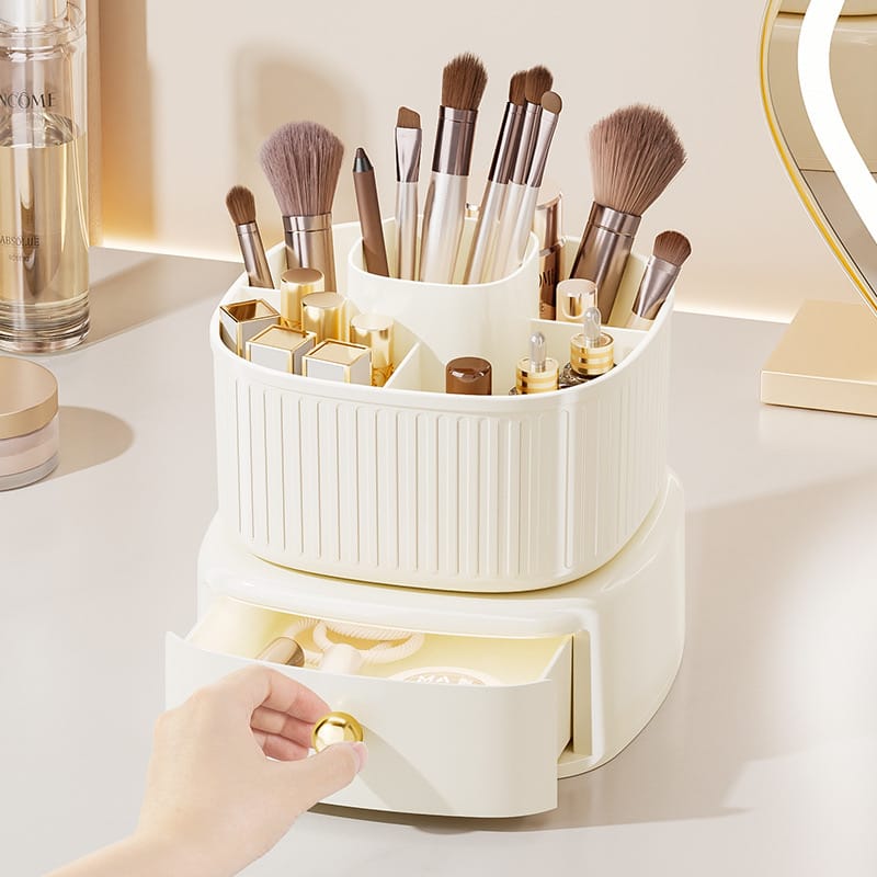 Rotating Makeup Organizer With Drawer Holding Makeup Items.