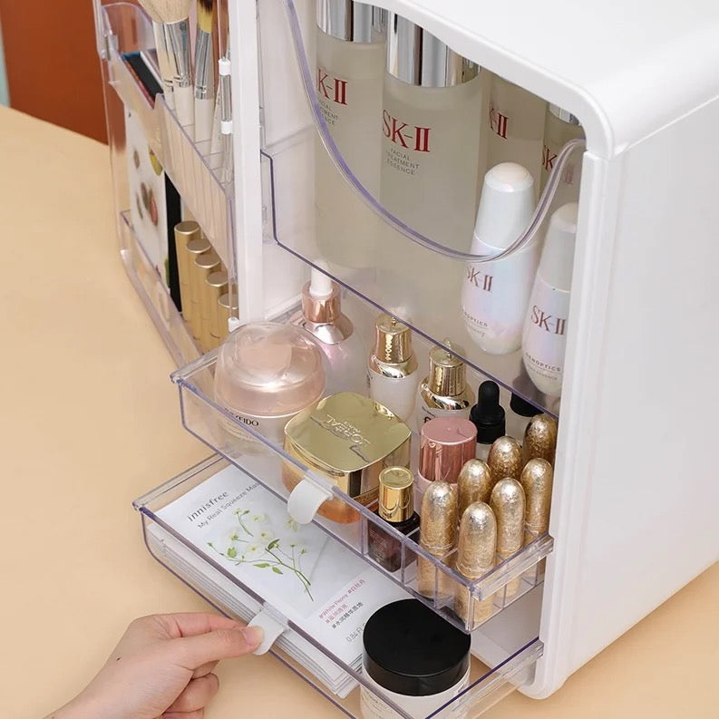 A Women Organizing Makeup Storage Box is Organized With Cosmetics and Makeup Items.