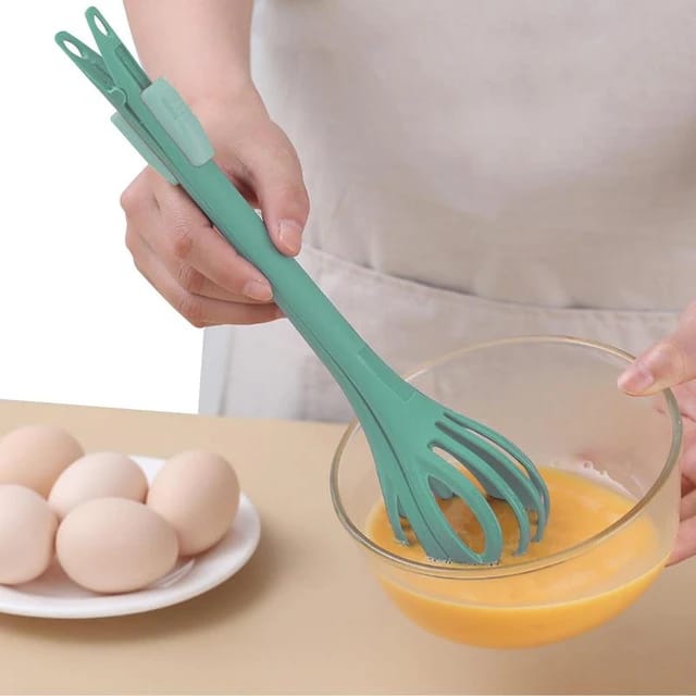 A Person Beats Egg Using Multi-purpose Manual Kitchen Whisk