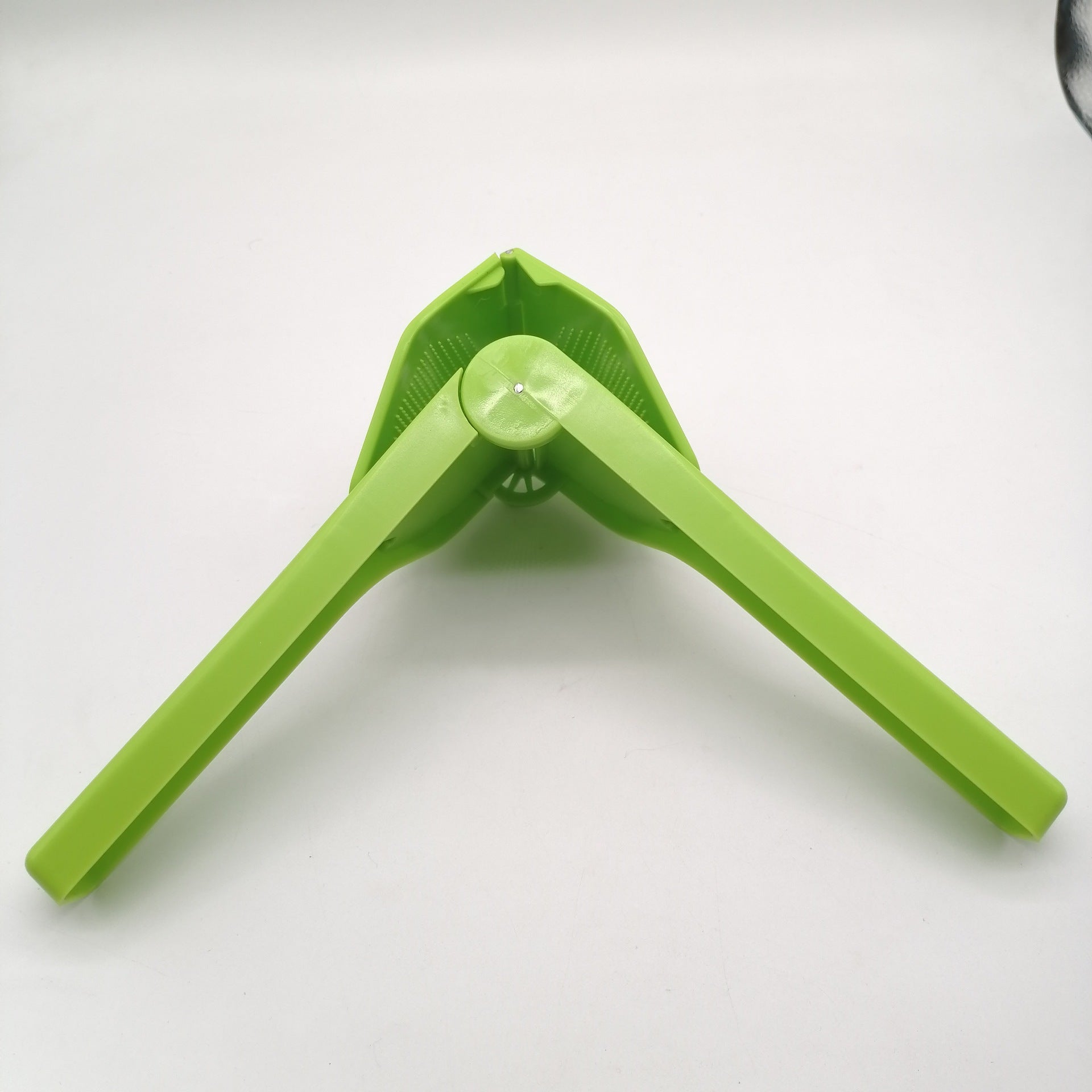 Manual Lemon Fruit Squeezer in Green Color.