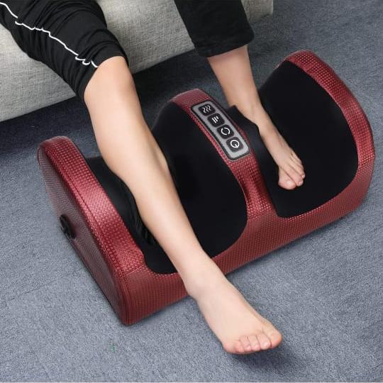 A Person is Massaging Leg Using Electric Foot Massager.