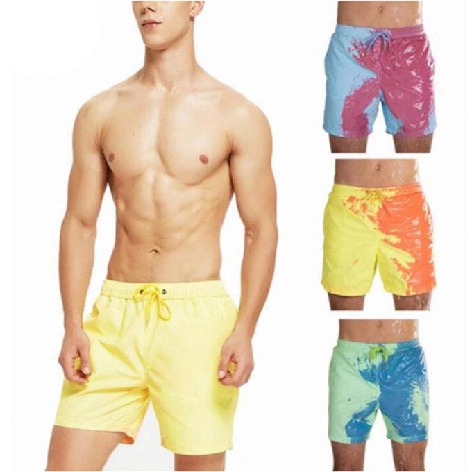 A Person is Wearing Men Color Changing  Beach Shorts.