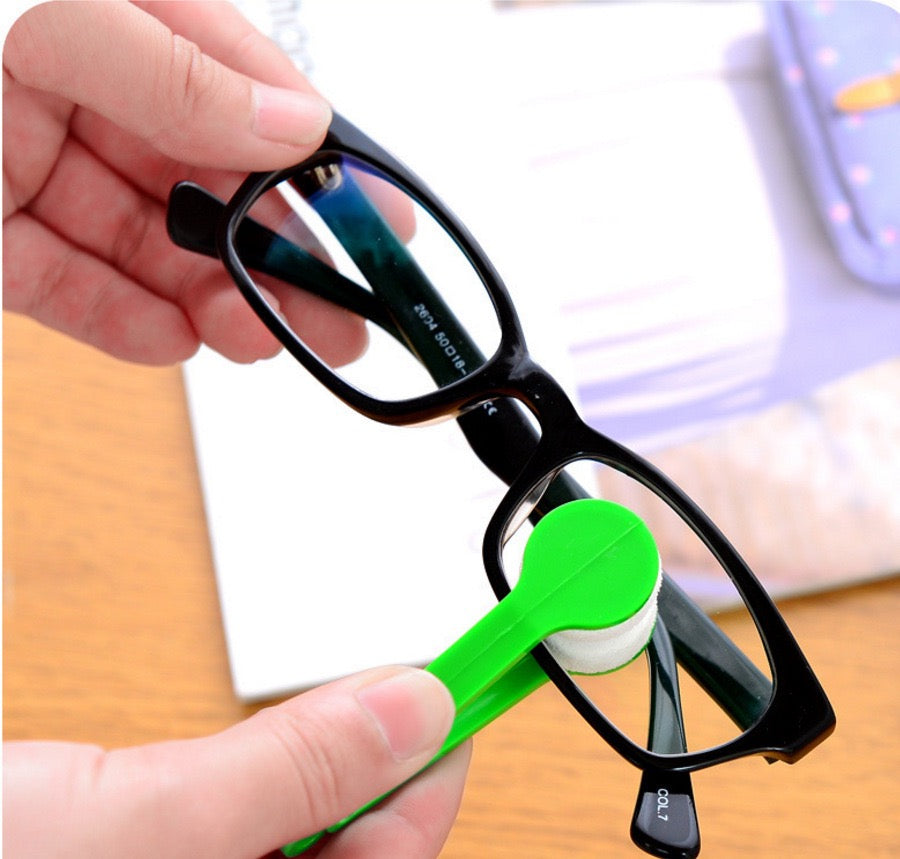 Someone cleaning glass with a Microfiber Eyeglass Cleaning Tool