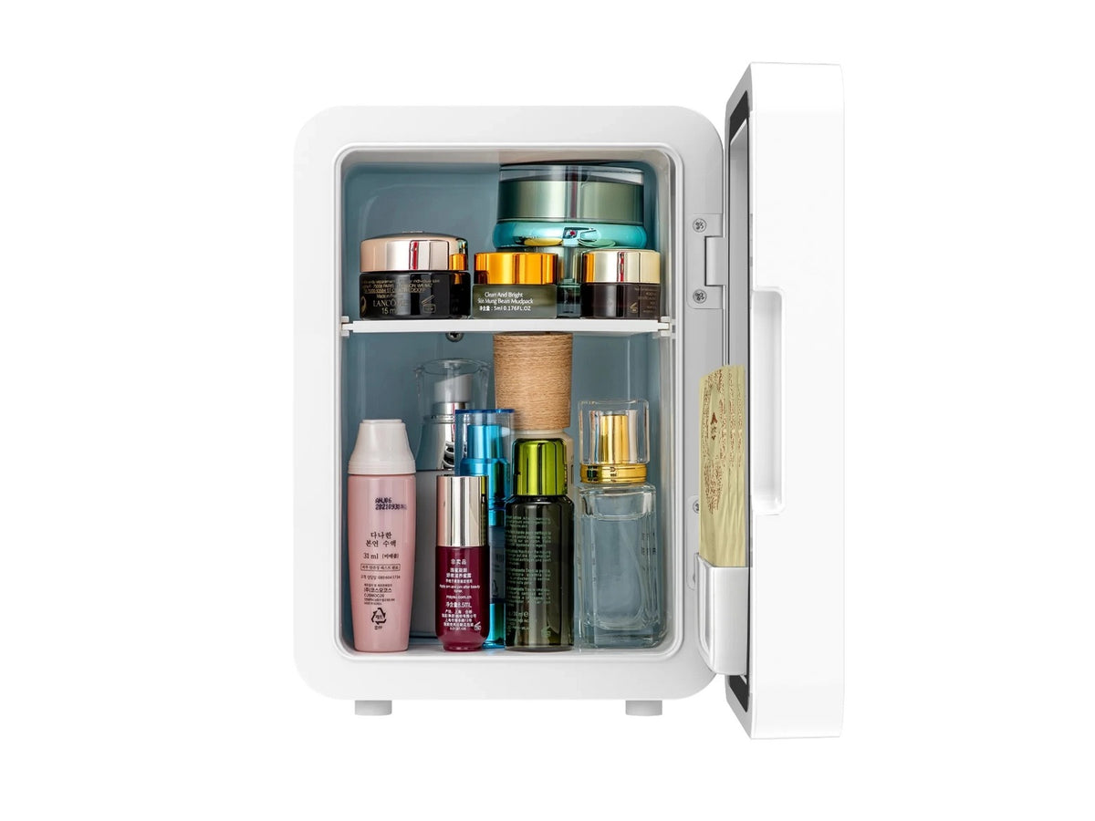 Makeup Items and Cosmetics Are Arranged On the Mini Multifunction Cosmetic Refrigerator With Mirror.