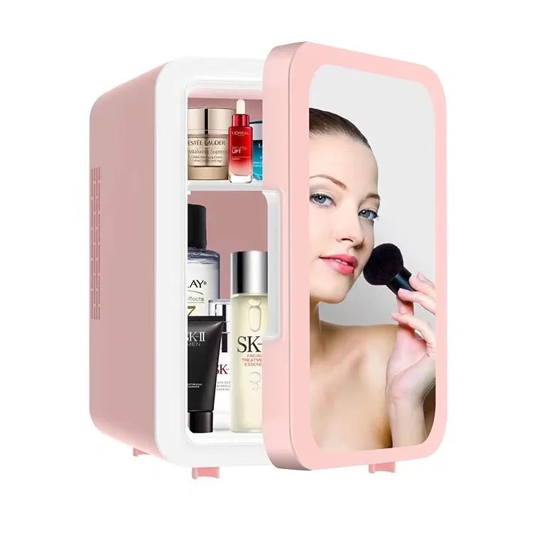 A Women is Doing Makeup By Looking The Mirror Of Mini Multifunction Cosmetic Refrigerator.