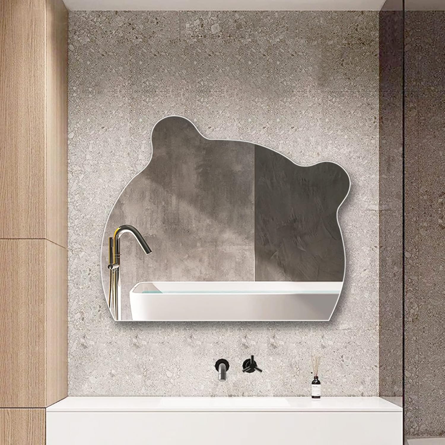 A Modern LED Bathroom Mirror is Kept on the Wall Near Washbasin.