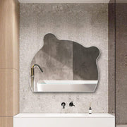A Modern LED Bathroom Mirror is Kept on the Wall Near Washbasin.