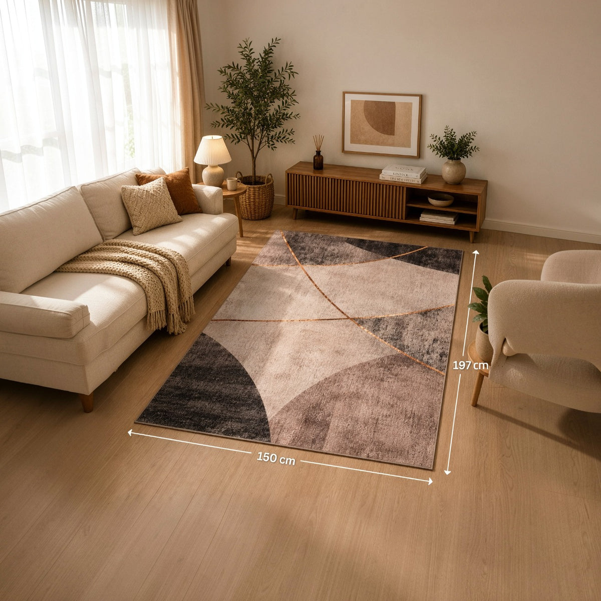 Living room with a geometric patterned rug, beige sofa, and armchair.