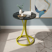A Modern Round Coffee Table is Organized with Some Decor Items.