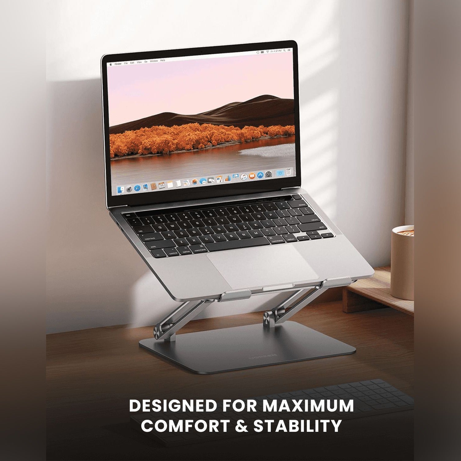 a Moxedo Aluminum Laptop/ Tablet Stand Holding Laptop.