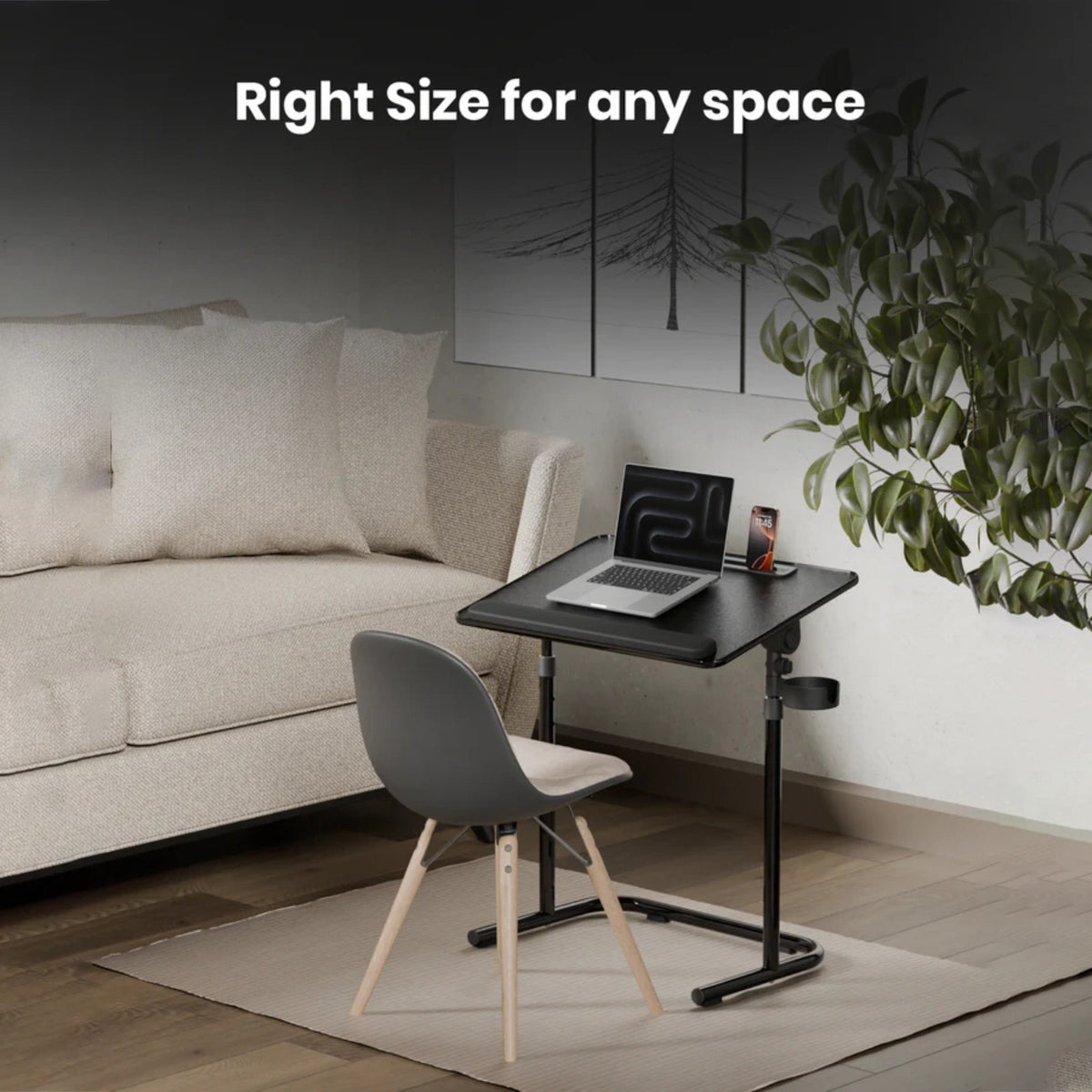 Moxedo FlexMate Adjustable Height Laptop Desk with a laptop and phone on the surface, paired with a gray chair in a modern living room setting. White text at the top reads 'Right Size for any space'.