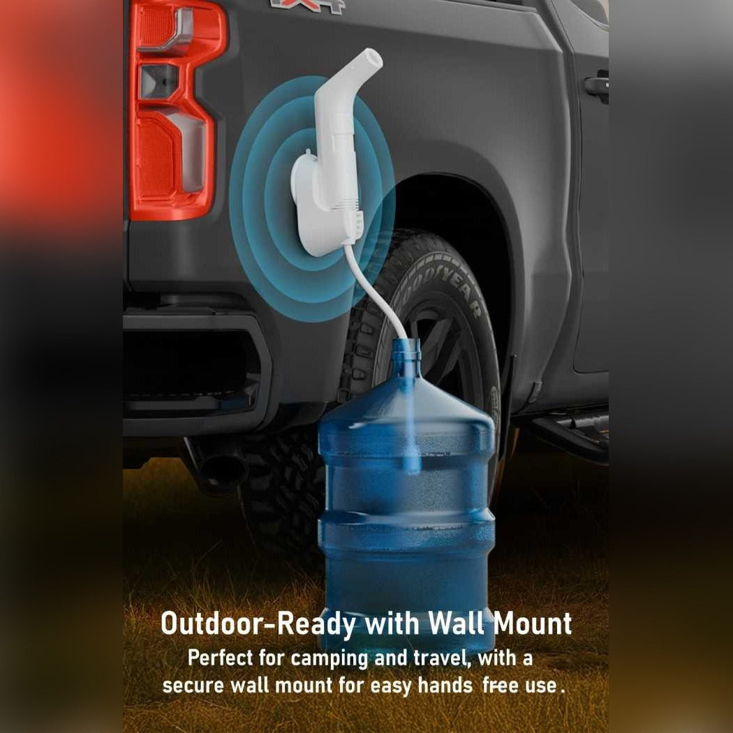 A Moxedo JetStream Portable Electric Bidet Sprayer  mounted on the rear door of a dark gray pickup truck, with blue water flowing into a large blue water jug. Text at the bottom reads 'Outdoor-Ready with Wall Mount' and 'Perfect for camping and travel, with a secure wall mount for easy hands free use.
