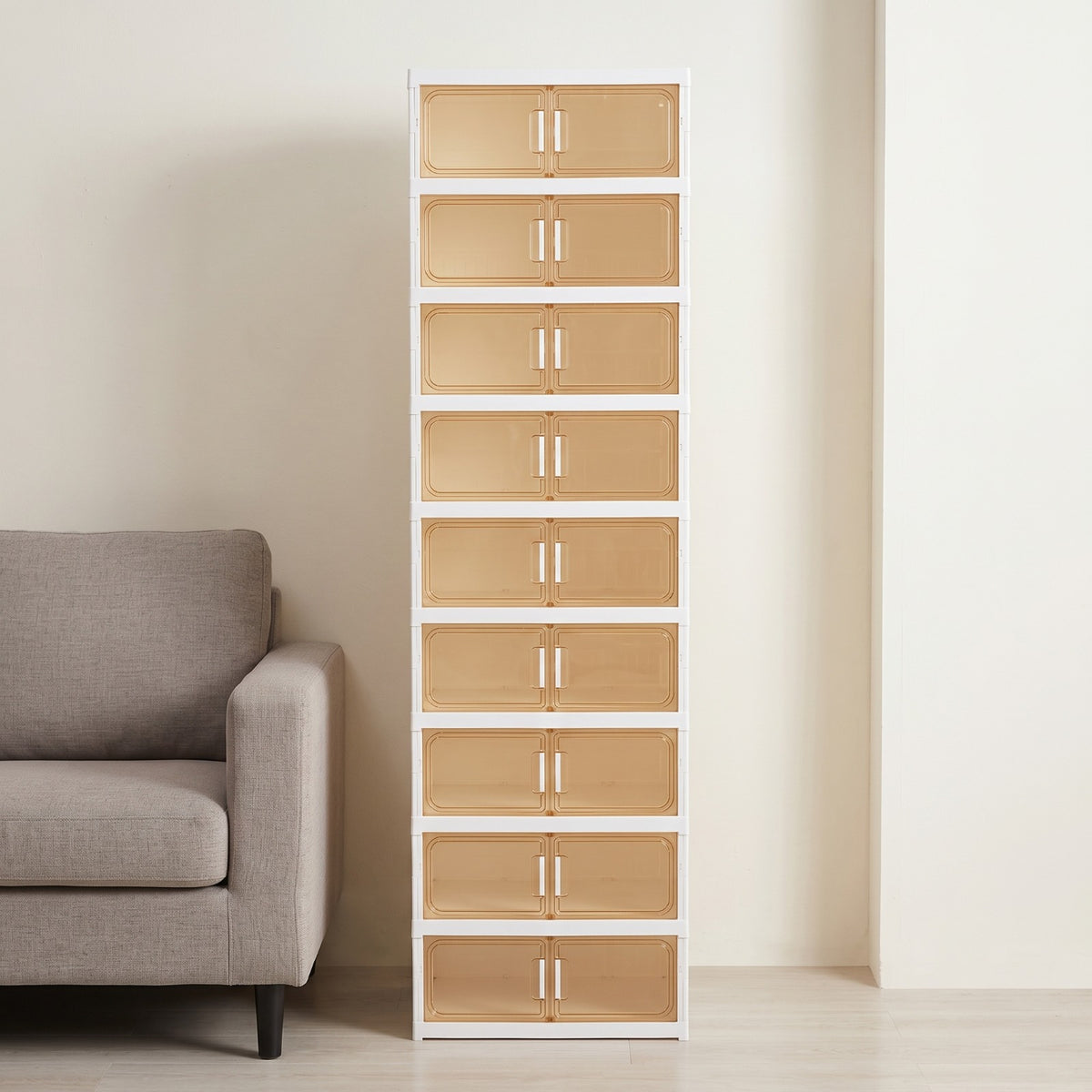 Multi-Tiered Shoe Storage Cabinet Beside a Sofa Set.
