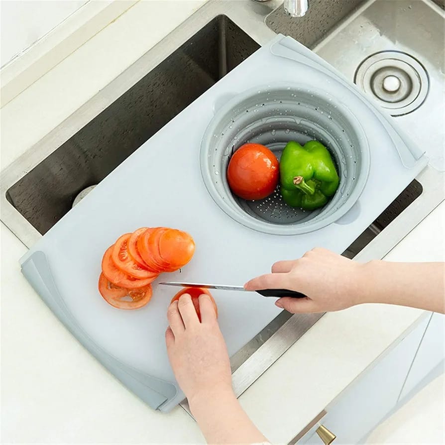 A Person is Cutting Vegetable in Multifunctional Chopping Board.