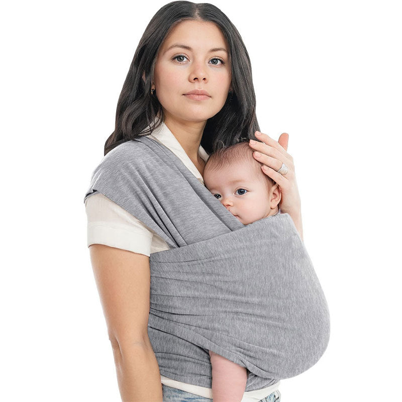 A Women is Holding Her Baby Using Newborn Baby Wrap Carrier Cloth in Grey Color.