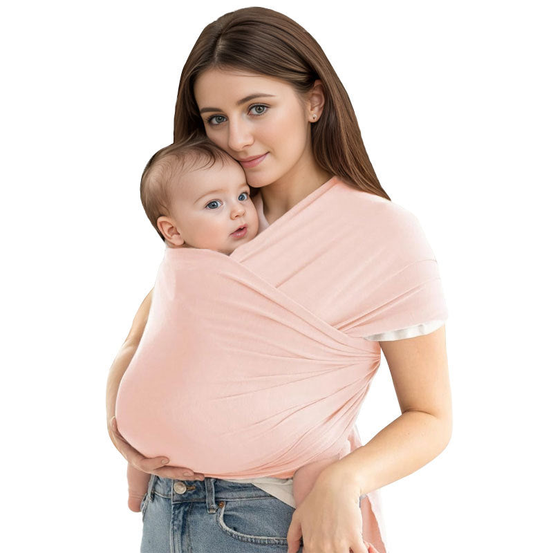 A Women is Holding Her Baby Using Newborn Baby Wrap Carrier Cloth in Pink Color.