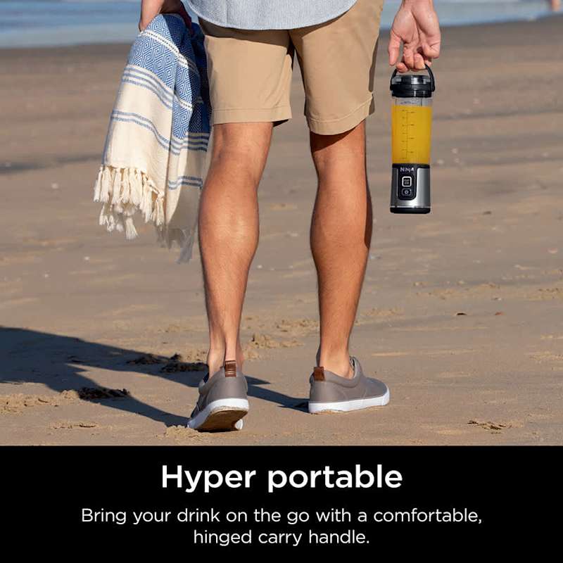 A Person is Holding Ninja Blast Portable Blender,