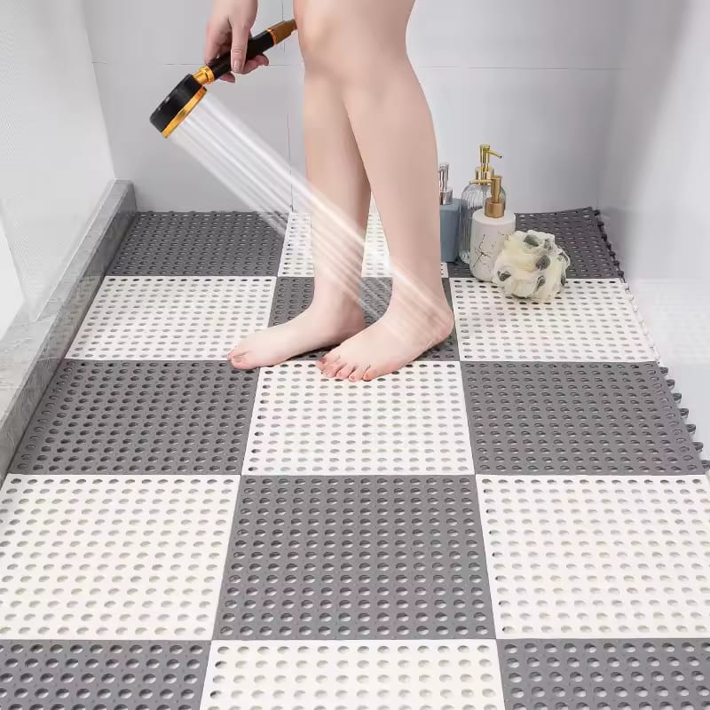 A Person is Bathing by Standing in a Non-Slip Bathroom Shower Mat.