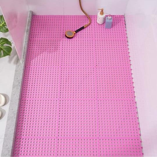 A Non-Slip Bathroom Shower Mat is Placed at the Floor Of Shower Room.