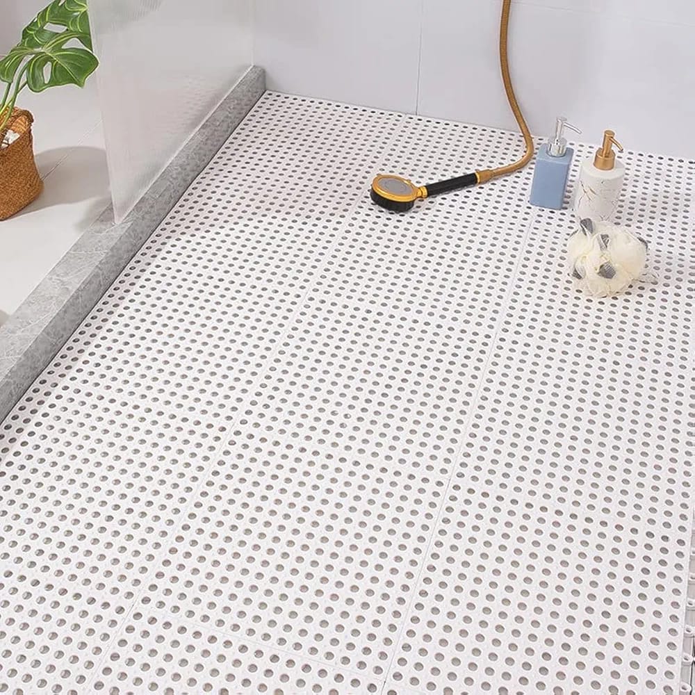 A White Non-Slip Bathroom Shower Mat is Placed at the Floor Of Shower Room.