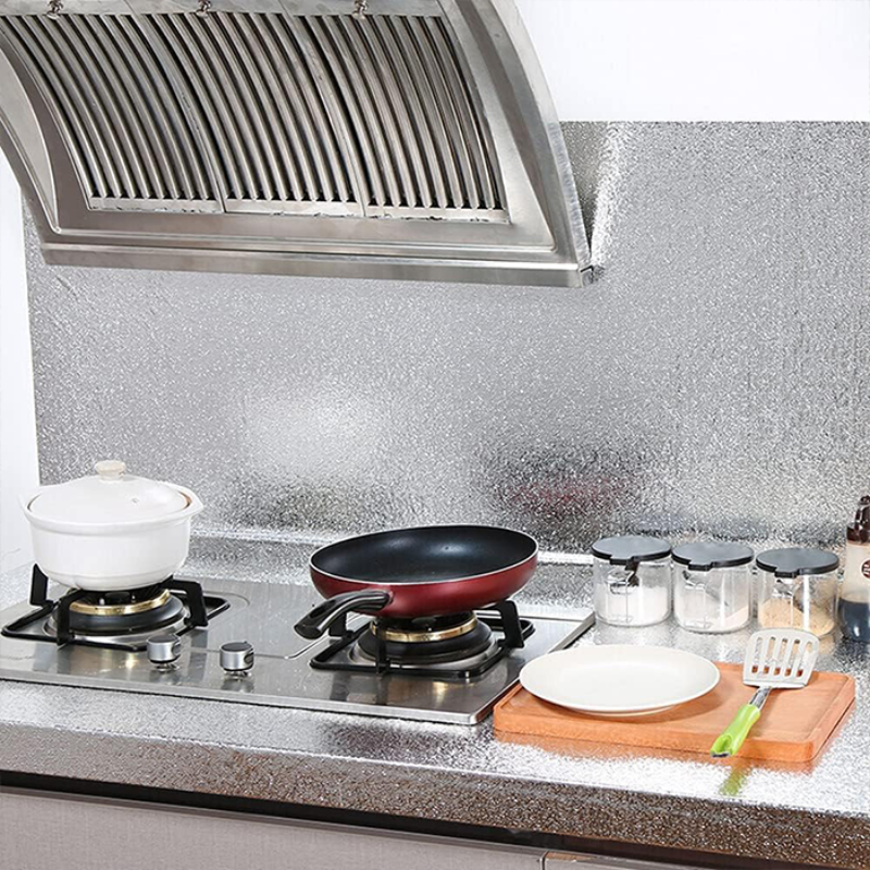 A Waterproof Oil Proof Aluminium Foil Sticker is used in a Kitchen Wall.