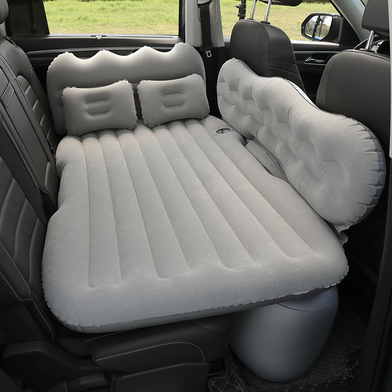 Gray Portable Travel Inflatable Car Bed placed in a car