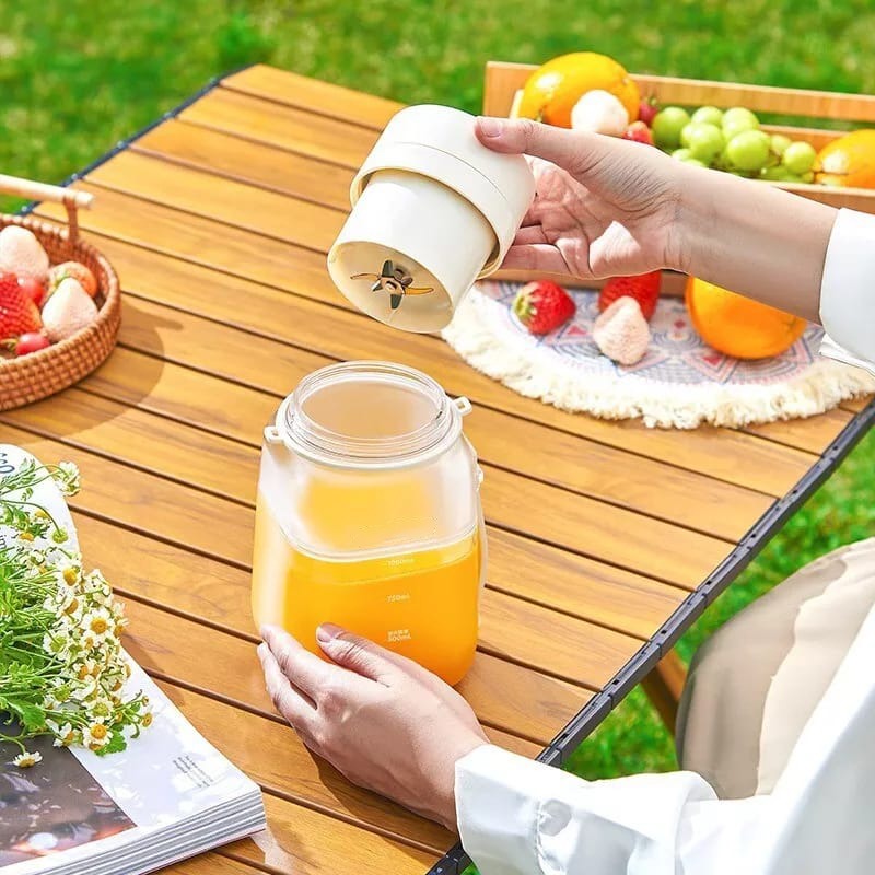 A Person is Opening Portable Electric Juicer Blender Cup.